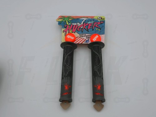 Gripy ODI Hucker Flange w kolorze szaro/pomarańczowym z metką. Widok z przodu