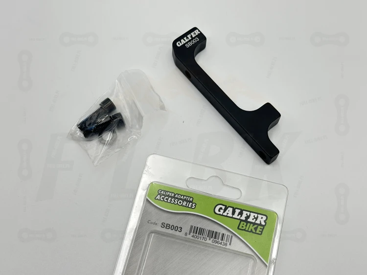 Adapter zaicsku hamulcowego galfer SB003 +63mm. Na tle oryginalnego opakowania
