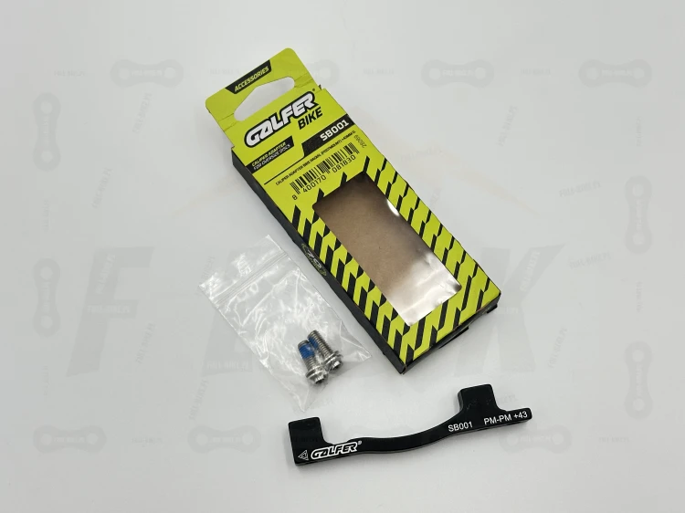 Adapter zacisku hamulcowego Galfer SB001 +43mm. Na tle oryginalnego opakowania