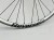 Koło Tylne Reverse Black One 27,5" 148x12 Single speed srebrne z srebrną piastą dartmoor reel expert boost single speed. Zbliżenie na srebrny napis reverse oraz logo producenta.