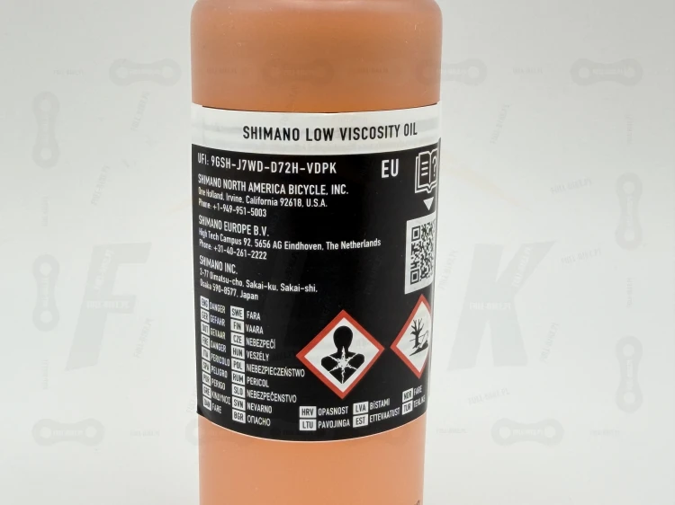 Płyn Hamulcowy Mineralny Shimano Low Viscosity główne zdjęcie z logiem producenta i dokładnym modelem produktu oraz widok na etykiete informacyjną