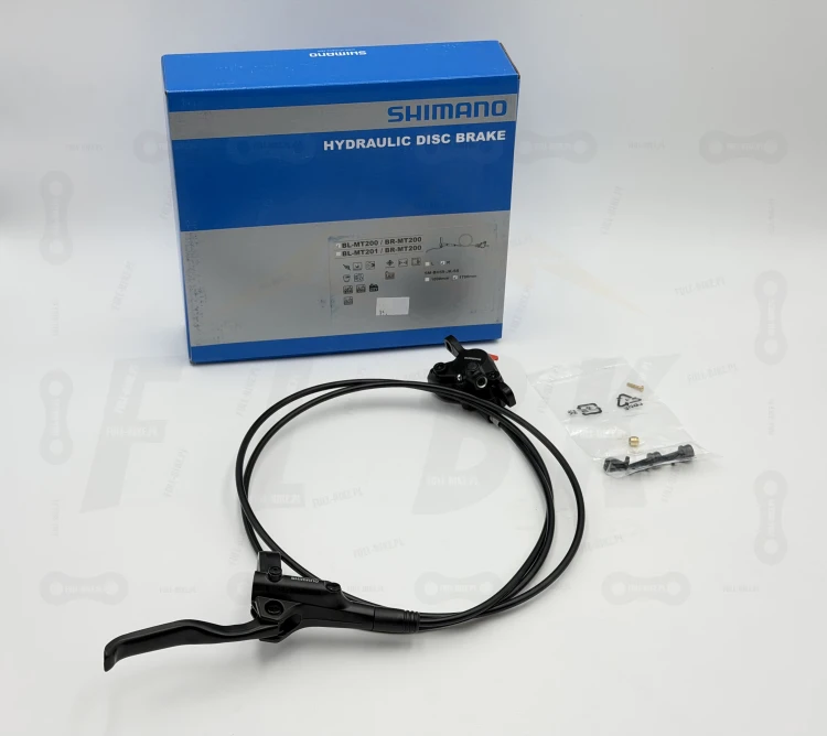 Hamulec tarczowy Shimano Mt-200, na zdjęciu jest tylni hamulec wraz ze śrubami mocującymi zacisk oraz opakowanie producenta gdzie widnieją wszystkie informacje o produkcie