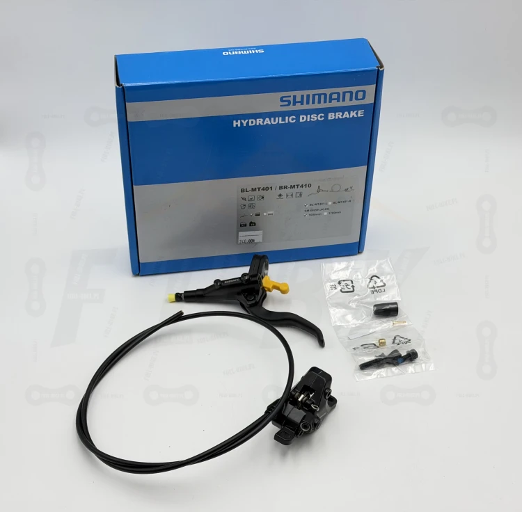Hamulec tarczowy Shimano Mt-401/410 na zdjęciu widać przedni hamulec wraz z niezbędnymi cześciami takie jak śruby mocujące oraz opakowanie producenta ze wszystkimi informacjami o produkcie